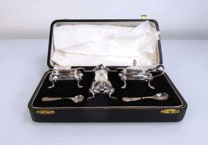 A silver five piece cruet set of typical form maker S Ltd., Birmingham 1961, cased Lid to pepper