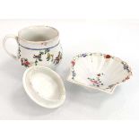 A Champions Bristol chocolate cup and cover decorated with floral swags, h. 7 cm, together with a