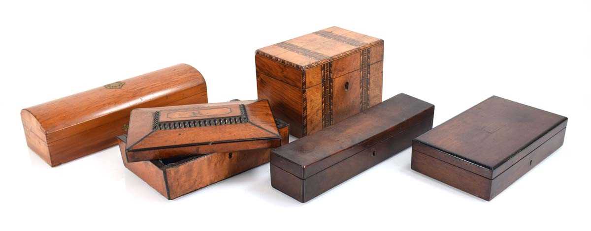 A group of five various boxes including a walnut and marquetry box, two pen boxes, a draughtsmen box