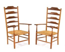 A pair of Thomas Hudson 'Cowman' elm and rush seated shaker-type armchairs, each with a cow