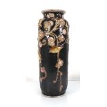 A Royal Doulton stoneware vase of cylindrical form, relief decorated with stylised birds, h. 37.5 vm