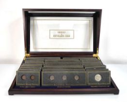 Two glazed display cases containing a set of Danbury Mint 'Collectible Coins of America', comprising