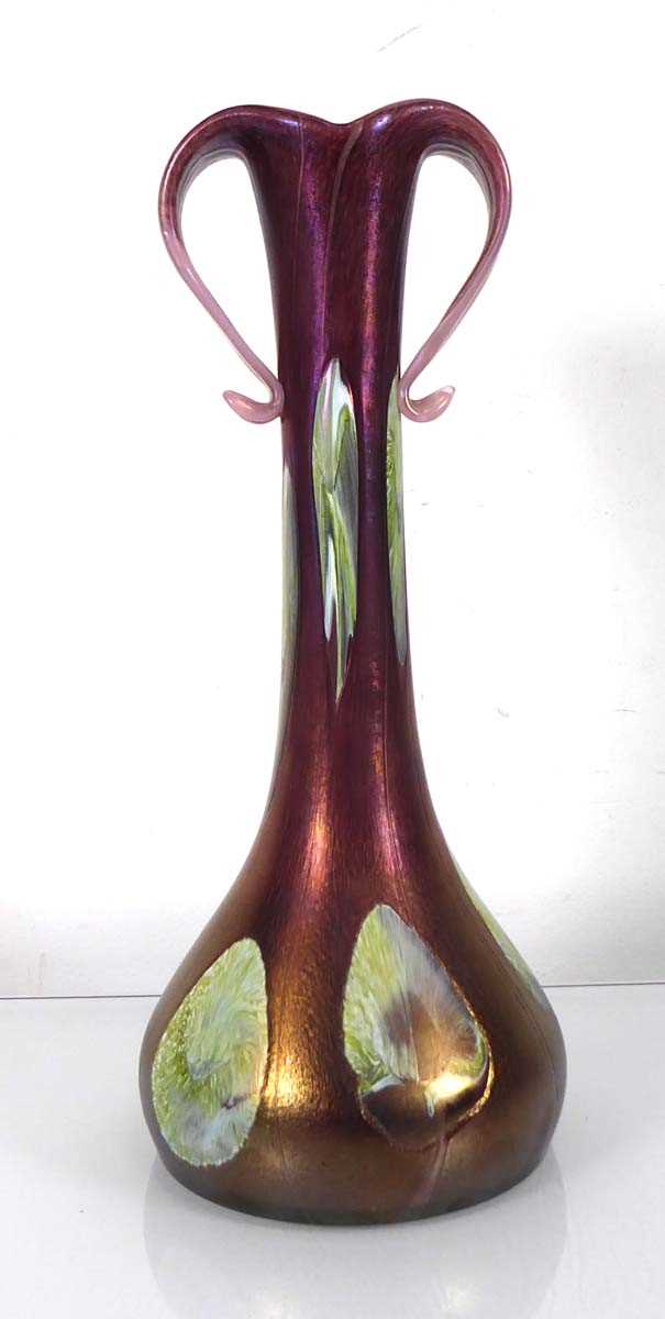 A Loetz style two handled pink and opaline iridescent glass vase of flared Art Nouveau design, in