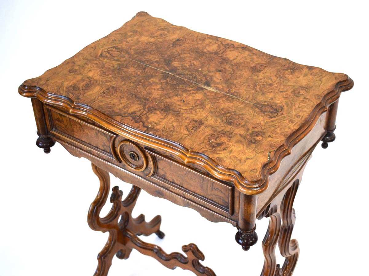 A Victorian figured walnut sewing table, the lid enclosing a maple lined interior with detachable - Image 2 of 3