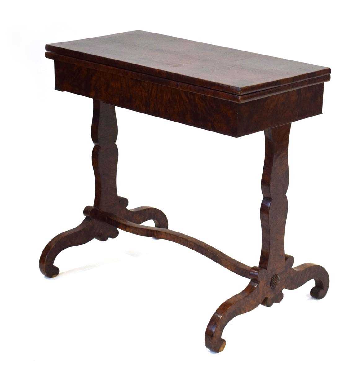 A 19th century burr walnut and 'scumbled' card table, the folding surface over a plain frieze on