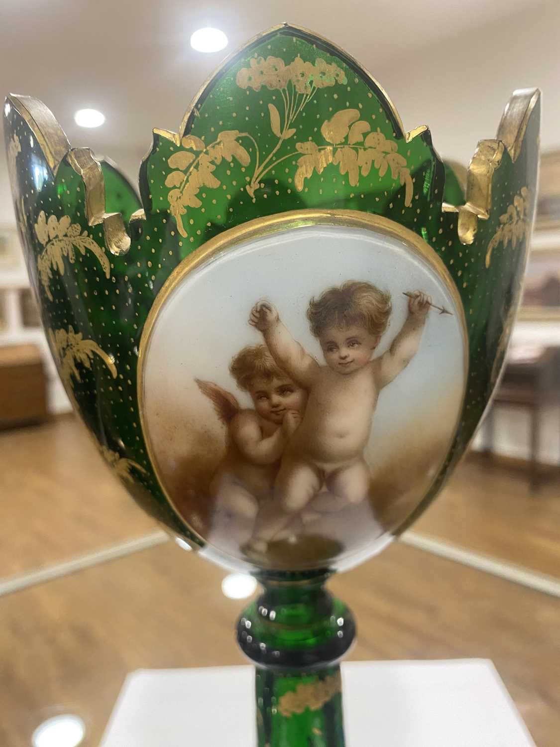 A Bohemian green glass vase of goblet form decorated with a pair of putti within a gilt fern - Image 4 of 26