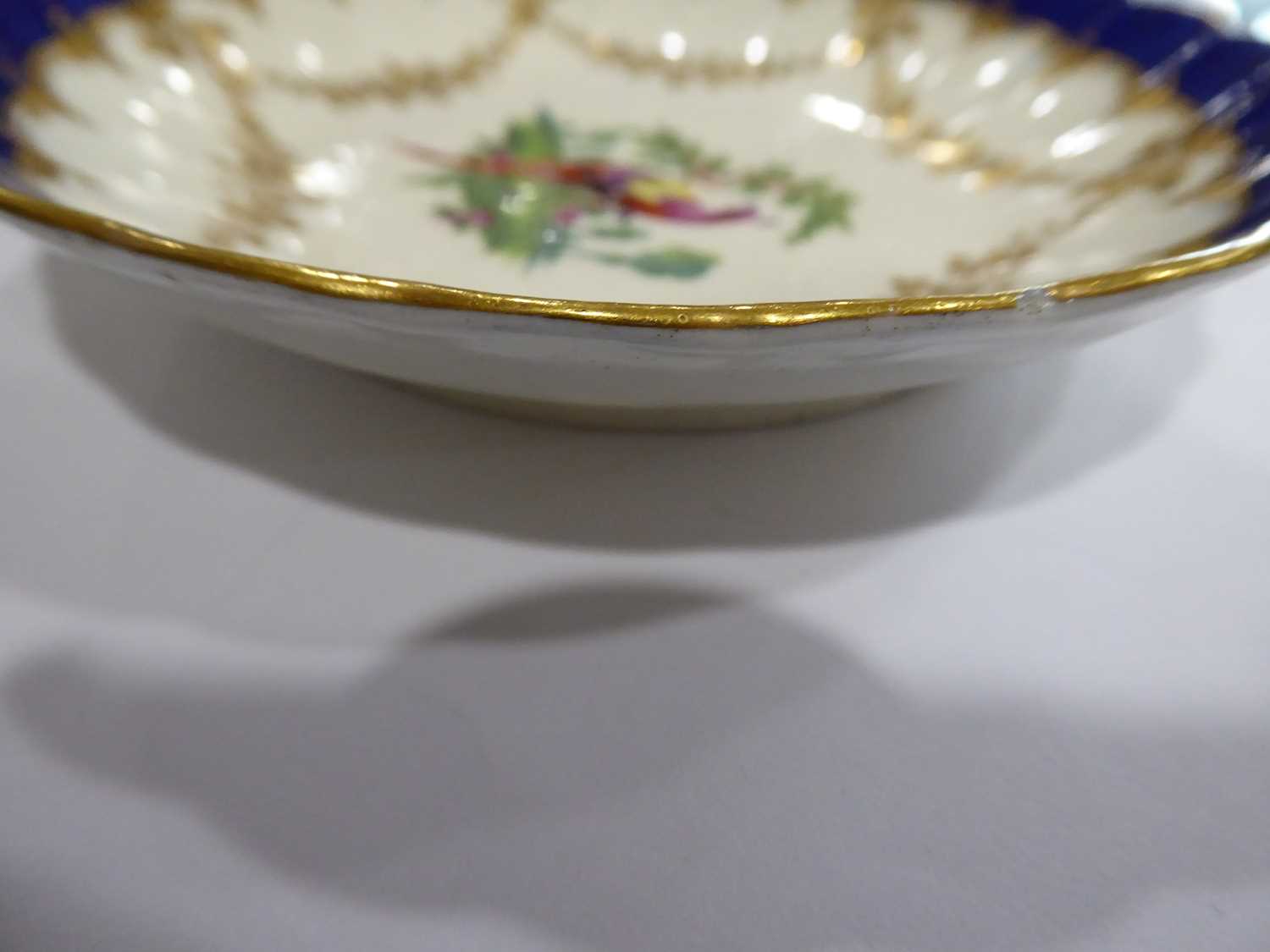 An early Worcester tea cup and saucer dish, each decorated with an exotic bird with a blue and - Image 5 of 6