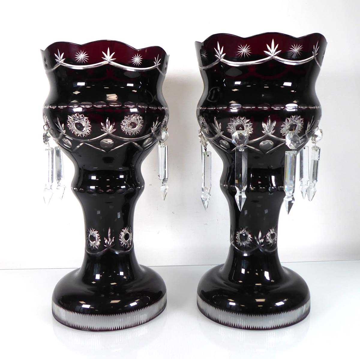 A pair of deep cranberry glass table lustres of typical form, h. 36 cm (2)