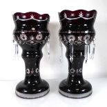 A pair of deep cranberry glass table lustres of typical form, h. 36 cm (2)