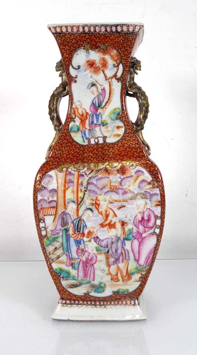 A Chinese Export slab vase decorated in coloured enamels with figures at leisure within a rust