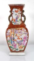 A Chinese Export slab vase decorated in coloured enamels with figures at leisure within a rust