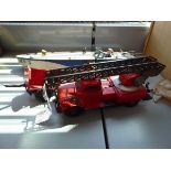 A JEP clockwork racing boat, a Gama fire rescue and two further items of tinplate (4) Incomplete and