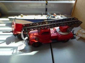 A JEP clockwork racing boat, a Gama fire rescue and two further items of tinplate (4) Incomplete and