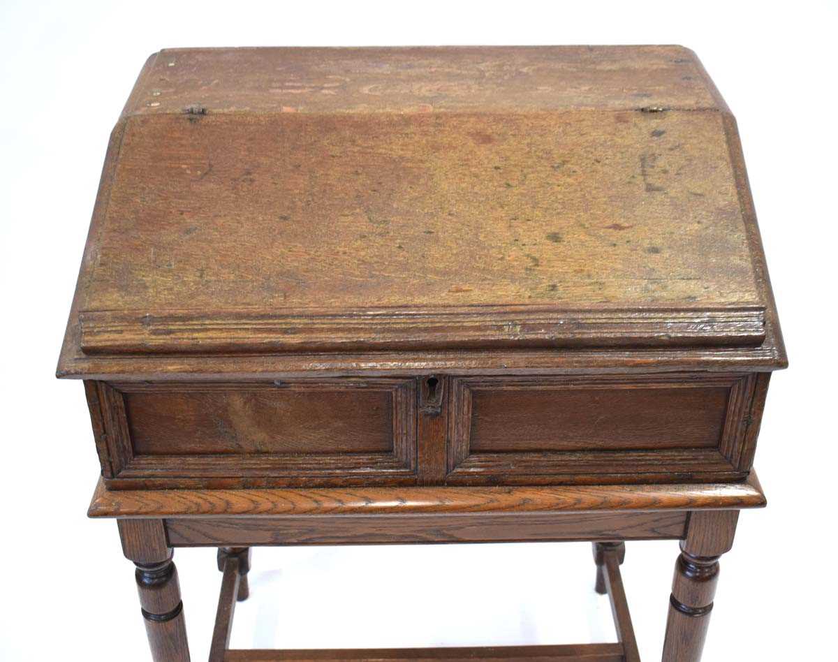 An oak clerk's desk, the sloped surface enclosing six drawers, on a later oak stand, 68 x 52 x 91 - Image 3 of 6