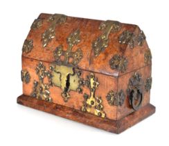 An Irish 19th century letter tidy of Gothic form, the oak body with brass mounts, the interior