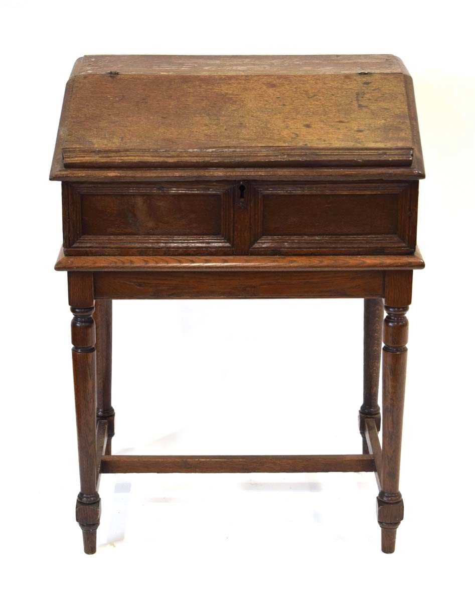 An oak clerk's desk, the sloped surface enclosing six drawers, on a later oak stand, 68 x 52 x 91 - Image 2 of 6