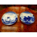A pair of blue and white Copeland chargers decorated with views of Carnarvon and Conwy Castle, d.