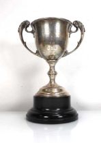 An early 20th century silver two handled trophy vase with leaf capped handles, maker BBS Ltd.,