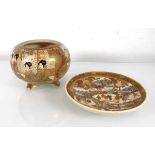 A Satsuma bowl of squat globular form typically decorated with geisha at leisure, h. 9.5 cm,