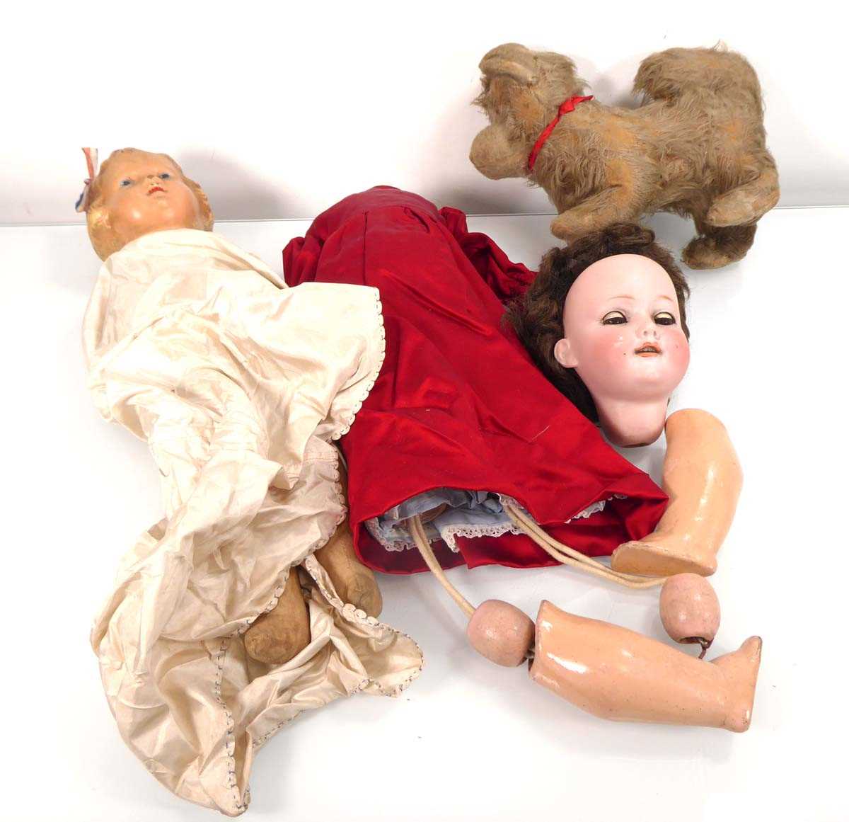 An Armand Marseille bisque headed doll with sleeping brown glass eyes and open mouth showing four