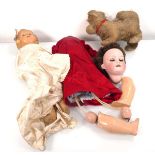 An Armand Marseille bisque headed doll with sleeping brown glass eyes and open mouth showing four