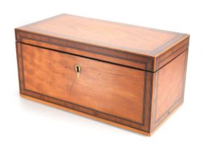 An early 19th century satinwood, walnut banded and marquetry tea caddy, the interior with two