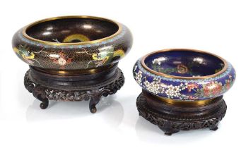 A cloisonné bowl decorated with dragons, di. 28 cm, together with another smaller bowl, both on
