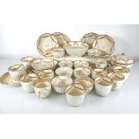 A group of 19th century tea bowls, tea cups and saucer dishes, each gilt decorated with the