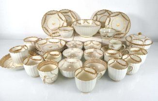 A group of 19th century tea bowls, tea cups and saucer dishes, each gilt decorated with the