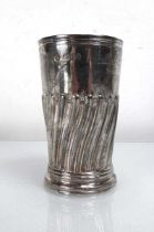 A Victorian silver and parcel gilt beaker with gadrooned decoration, maker WG JL, London 1891, h. 10