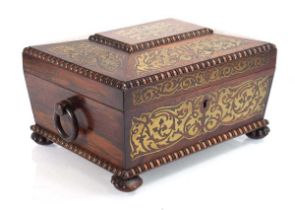 A Regency rosewood and brass inlaid jewellery box of sarcophagus form, the fitted interior with a