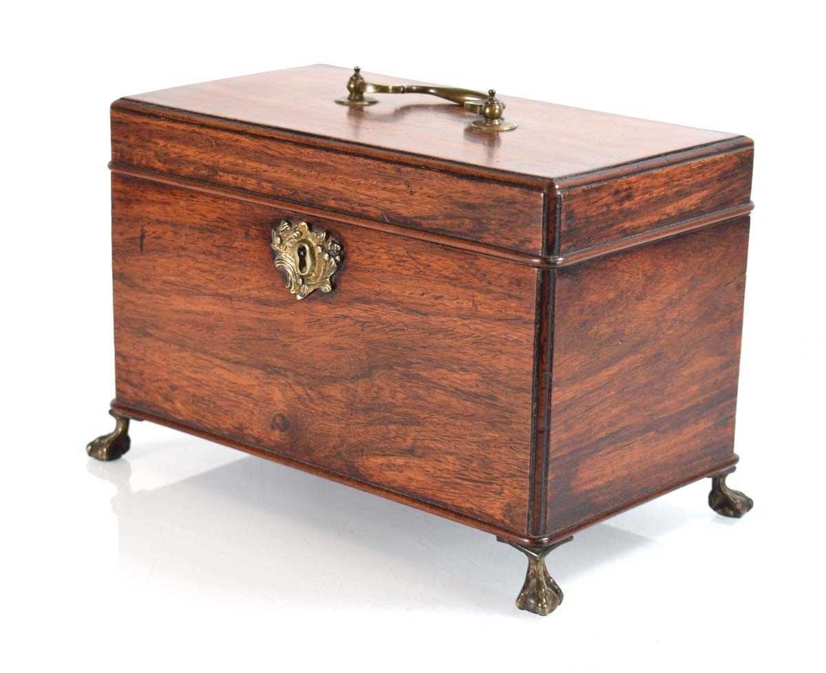 A George III mahogany box, the interior with three compartments, on brass ball and claw feet, 25 x