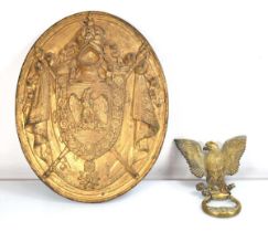 A French tole relief plaque in the form of a coat of arms, 43 x 34 cm, together with a brass door