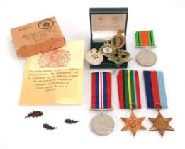 A group of Second World War medals in a box addressed to 'Mrs G.E. Hipgrave 16950' including