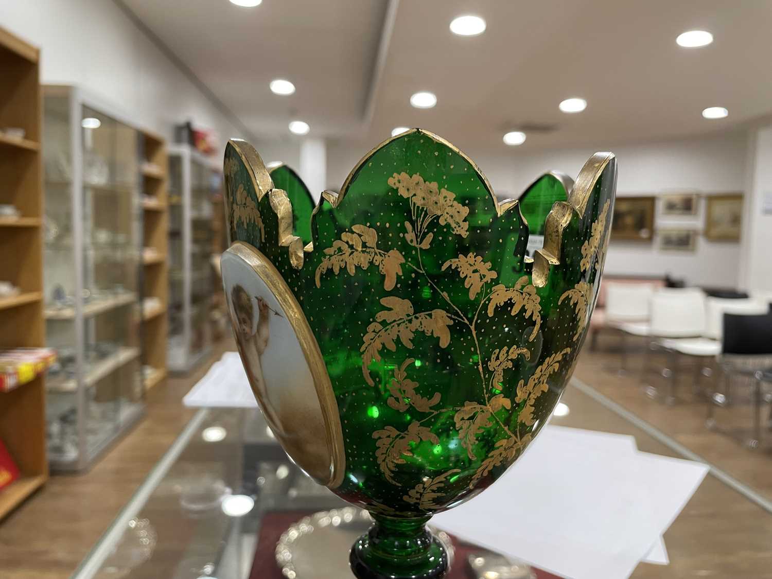 A Bohemian green glass vase of goblet form decorated with a pair of putti within a gilt fern - Image 13 of 26