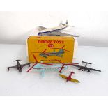 A Dinky 715 Bristol 173 helicopter, boxed and four loose aeroplanes (5) Playworn