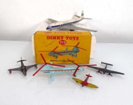 A Dinky 715 Bristol 173 helicopter, boxed and four loose aeroplanes (5) Playworn