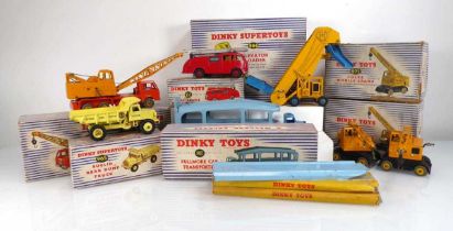 Eight Dinky commercial models: 965 Euclid read dump truck, 982 Pullmore car transporter and 994