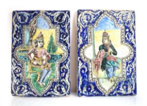 A pair of enamelled plaques depicting courtiers within architectural settings, 50 x 34 cm Both