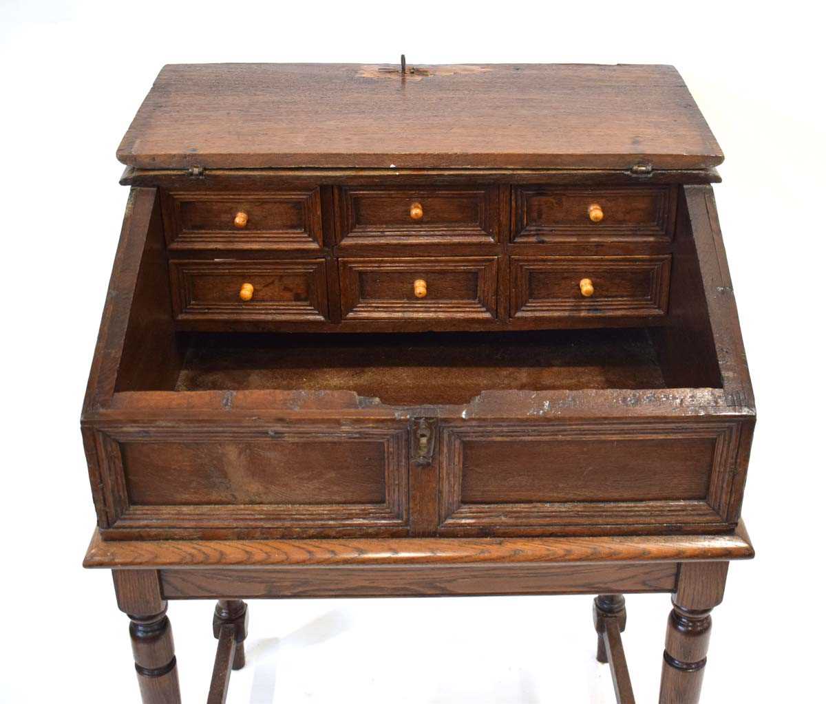 An oak clerk's desk, the sloped surface enclosing six drawers, on a later oak stand, 68 x 52 x 91 - Image 4 of 6