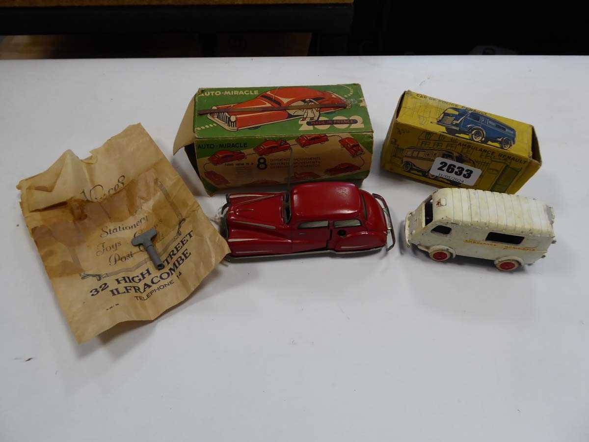 A Joustra 2002 clockwork car and a French Renault ambulance, both boxed (2) Playworn
