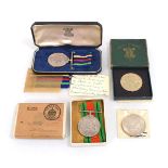 A cased Civil Defence Long Service Medal together with a Second World War Defence Medal, a 1951
