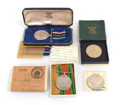 A cased Civil Defence Long Service Medal together with a Second World War Defence Medal, a 1951