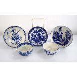 Two early Worcester blue and white tea bowls and three saucer dishes, each decorated in the Oriental