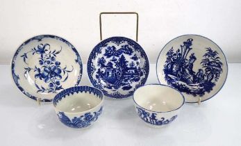 Two early Worcester blue and white tea bowls and three saucer dishes, each decorated in the Oriental