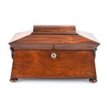 A mid-19th century rosewood tea caddy of sarcophagus form, the interior with two detachable