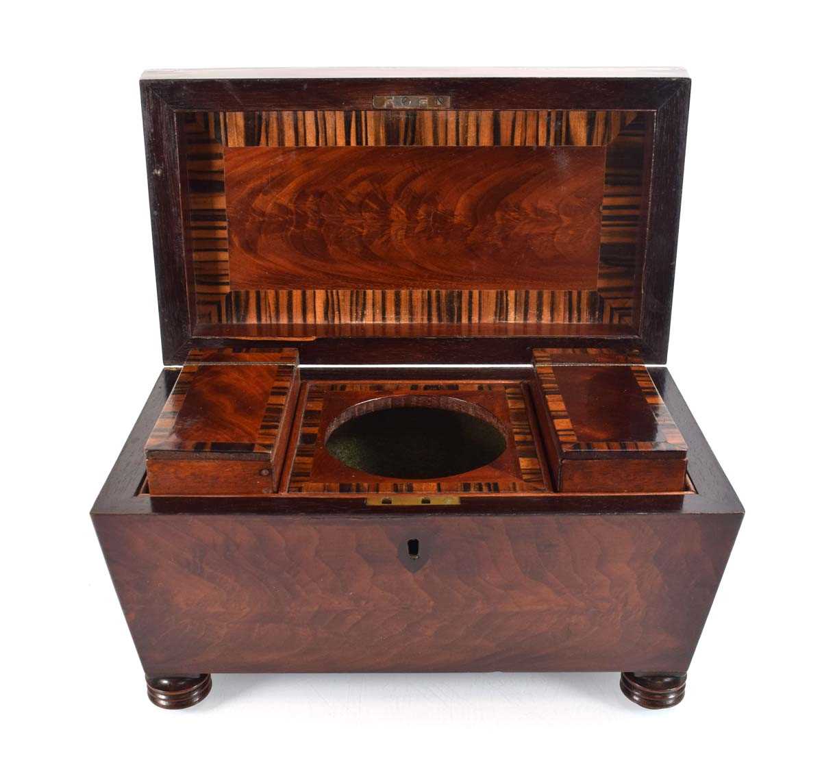 A 19th century mahogany and rosewood banded tea caddy, the interior with two detachable