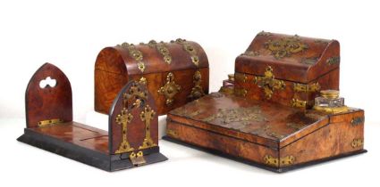 A Victorian walnut and brass mounted desk tidy/slope in the Gothic manner, together with a similar