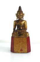 A Burmese (?) polychrome and gilded wood figure modelled as Lanna Buddha, h. 30 cm