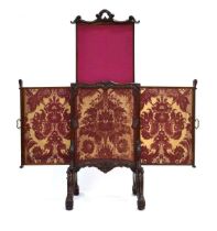 A mid-19th century mahogany screen by William Bertram & Sons of Soho, with pull-out slides to the